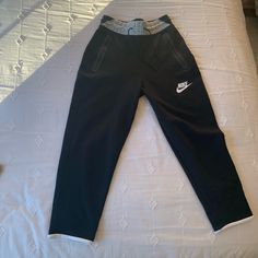 White Piping On Legs Zip Up Pockets Never Worn, Tags Were Just Taken Off Black Athleisure Capri Bottoms, Black Athleisure Capri Length Pants, Nike Black Bottoms With Pockets, Black Athleisure Capris With Pockets, Black Capri Lounge Pants, Casual Black Capris For Loungewear, Nike Pants, Nike Black, Black Nikes