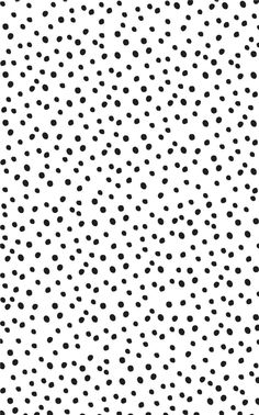 a black and white dotted background with small dots on the bottom half of the image