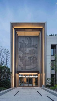 the entrance to an office building at dusk