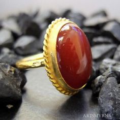 ARTSMYRNA METAL: 925k Silver GEM: Carnelian ( lab created ) Diameter Stone Size: 14x10 mm COATING: 24k gold over (We can made a special type of coating for your personal preference ) MATERIEL : 925K Sterling Silver ( Some of my items vermeil gold over silver for looks rich . But i can finish in silver too ) RING SIZE: 6 (your desired size is made) SPECIAL ORDER IS MADE. If you send us a photo of your desired model (you can send your gem.) We can do it for you. We can make any design you want wit Oval Agate Ruby Ring For Anniversary, Antique Rings With Natural Stones For Gift, Oval Carnelian Wedding Rings, Handmade Heirloom Rings With Oval Cabochon, Heirloom Handmade Oval Cabochon Rings, Elegant Carnelian Rings For Wedding, Amber Heirloom Ring As A Gift, Amber Heirloom Ring As Gift, Heirloom Amber Rings As A Gift