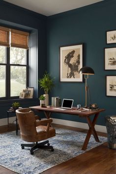 a home office with blue walls and wooden floors