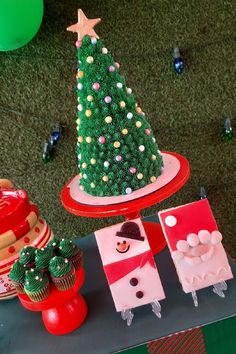 a christmas tree made out of cupcakes on a table