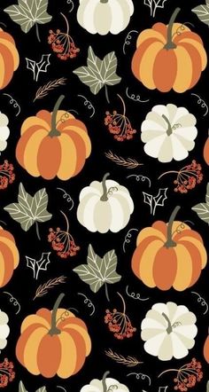 a black background with orange and white pumpkins