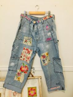 Fabulous super soft breezy and delicious upcycle with added patching and detailing. Waist adjust from 36.5 down to 31, or smaller, with three crossover buttons. Rise 13, inseam 26. Slouchy super fun and festival ready! Distressed Denim Blue Cargo Jeans For Summer, Summer Distressed Denim Blue Cargo Jeans, Summer Distressed Denim Cargo Jeans, Distressed Medium Wash Cargo Jeans For Summer, Spring Streetwear Jeans With Patches, Cotton Medium Wash Bottoms With Patches, Vintage Cotton Cargo Jeans For Spring, Vintage Denim Blue Cargo Jeans For Spring, Blue Patched Jeans For Summer