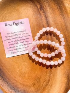 Rose Quartz 8mm crystal bracelet  Rose Quartz is the stone of Unconditional Love, perfect for Valentines. All these products will come individually packaged with a card explaining the properties of Rose Quartz.  Rose Quartz Beads bracelet, elastic. Rose Quartz - Love - Compassion - kindness Rose Quartz is a stone of unconditional love that carries a soft, feminine energy. It opens and cleanses the heart chakra, allowing vibrations of love to flow freely and without fear. It promotes healthy and Rose Quartz Bracelet Beads, Bracelet Heart, Rose Quartz Bracelet, Rose Quartz Beads, Crystal Beads Bracelet, Stone Crystal, Bracelets Handmade Beaded, Rose Quartz Crystal, Chakra Stones