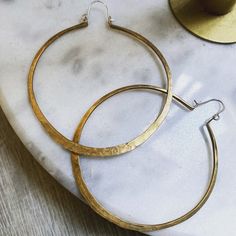 You can never go wrong with a classic pair of hoop earrings - hand forged brass metal - stering silver earhook - available in three sizes - sterling silver earhooks Made in oakland, CA Brass Hoop Earrings, Brass Hoops, Sustainable Fashion Brands, Twist Ring, Hammered Gold, Hand Chain, Earrings Minimalist, Gold Brass, Women Artisans