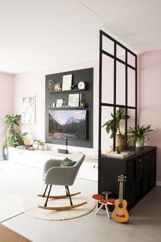 a living room filled with furniture and a flat screen tv