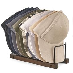 a hat rack with six hats on it