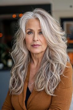 Embrace elegance with 12 gorgeous long hairstyles perfect for the woman over 60, designed to highlight natural beauty and sophistication. Med To Long Hairstyles For Women Over 50, Layered Thick Hair Long, Over 50 Long Hairstyles For Women, Long Layered Shag Haircut, Long Hair Over 60 Aging Gracefully