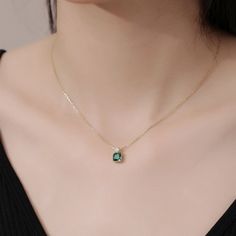 This exquisite pendant necklace showcases a brilliant emerald in a classic solitaire setting, radiating a lush green hue. Its elegant simplicity makes it a standout piece, perfect for enhancing any neckline with a touch of refined sophistication. Elegant Green Solitaire Necklace With Birthstone, Elegant Green Solitaire Necklace For May Birthstone, Elegant Green Round Birthstone Necklace, Elegant Green Round Solitaire Necklace, Classic Green Necklace For May Birthstone, Elegant Emerald Necklace With Round Pendant, Green Round Birthstone Necklace In Fine Jewelry Style, Elegant Emerald Round Pendant Necklace, Elegant Emerald Birthstone Necklace With Round Pendant