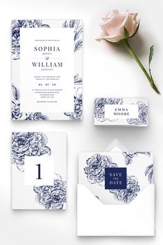 the wedding stationery is laid out on top of an envelope, with a rose