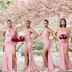 the bridesmaids are posing in pink dresses