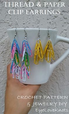 there is a cup with some paper clips in it and the words thread & paper clip earrings