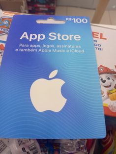 an apple store card sitting on top of a pile of toys