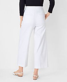 Elevate your wardrobe with the chic sophistication of Ann Taylor's The Kate Wide Leg Crop Pant. Perfectly tailored to flatter your figure, these pants boast a high-rise fit that sits just below the natural waist and a wide leg silhouette that adds a modern twist to your ensemble. The crisp white color enhances its versatility, making it a must-have for any fashion-forward wardrobe.

- Size: 4
- Color: White
- Gender: Female
- Material: 52% Cotton, 45% Polyester, 3% Elastane
- Fit: Tailored and f Elegant Cropped Wide Leg Pants For Spring, Chic Cropped Wide Leg Pants For Spring, Wide Leg Bottoms With Welt Pockets For Spring, Spring Wide Leg Bottoms With Welt Pockets, Spring Cropped Leg Pants With Welt Pockets, Cropped Leg Pants With Welt Pockets For Spring, Spring Cropped Pants With Welt Pockets, Versatile Straight Leg Culottes For Spring, Chic Cropped Leg Business Casual Bottoms