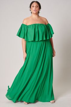 Classic and charismatic in this tasteful maxi dress. An off the shoulder ruffle creates a straight neckline that drapes over an elastic waist that separates a flowy natural A line silhouette. A classy dress that accentuates the shoulders, creating balance between the top and bottom half. - Ruffle drape- Elastic waist- Shirred- Lined- Comes in 7 ColorsSize + Fit - Model is 5'9" and wearing size 2X- Measurements taken from size 2X - Chest: 48"- Length: 56 1/2" Fabric Self: 100% Polyester Lining: 9 Flowy Off-shoulder Maxi Dress With Ruffles, Green Maxi Length Off Shoulder Dress, Green Ruffled Floor-length Maxi Dress, Green Floor-length Maxi Dress With Ruffles, Green Off-shoulder Maxi Dress For Spring, Green Flowy Maxi Dress, Green Maxi Dress With Ruffles And Flowy Skirt, Flowy Green Floor-length Maxi Dress, Green Off-shoulder Flowy Maxi Dress