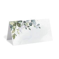 a white card with green leaves on it