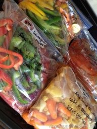 four bags of vegetables sitting on top of a counter next to each other in plastic wrappers