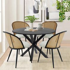 a dining table with four chairs around it