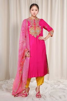 Magenta kurta with floral bloom embroidery. Paired with a contrast dhoti pant and dupatta with prints and embroidered border. - Aza Fashions Floral Embroidered Cotton Silk Salwar Kameez For Diwali, Floral Embroidery Cotton Silk Salwar Kameez For Diwali, Diwali Cotton Silk Salwar Kameez With Floral Embroidery, Diwali Floral Embroidered Cotton Silk Salwar Kameez, Pink Churidar With Floral Embroidery For Navratri, Pink Floral Embroidered Churidar For Navratri, Pink Floral Embroidery Churidar For Navratri, Silk Churidar With Floral Embroidery For Diwali, Floral Embroidered Churidar For Diwali With Traditional Drape