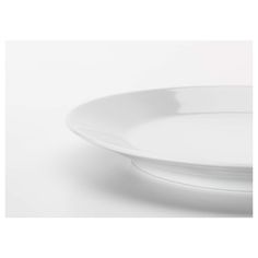 a white plate sitting on top of a table