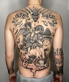 the back of a man with tattoos on his body