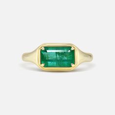 Classic Green Open Signet Ring, Timeless Emerald-cut Ruby Ring, Emerald Signet Ring For May Birthstone, Green 14k Gold Signet Ring With Bezel Setting, Luxury Emerald Rings With Polished Finish, Timeless Emerald Ring With Polished Finish, Luxury Green Gemstone Signet Ring, Timeless Green Signet Ring With Polished Finish, Fine Jewelry With Polished Emerald Finish