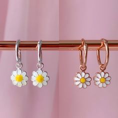 Get A Delicate And Delicate Look While Wearing This Cute Earrings. Also This Mini Hoops Are Perfect To Match Earrings With Your Little One. Silver Daisy Hoops Metal : 925 Sterling Silver. ( 925 Stamped ) Weight : 0,70g. Hoop Measurements : 1.2mm X 12mm Charm Measurements : 9mm X 9mm Materials : Enamel. Rose Gold Daisy Hoops Metal: 925 Sterling Silver. ( 925 Stamped ) Weight: 0,65g. Hoop Measurements: 1.2mm X 12mm Charm Measurements: 7mm X 7mm Materials: Enamel. Sterling Silver Flower Earrings For Summer, Sterling Silver Flower Earrings For Summer Gift, Summer Flower Sterling Silver Earrings For Gift, Summer Flower Earrings In Sterling Silver For Gift, Silver Adjustable Flower Earrings For Summer, Silver Flower Charm Earrings For Summer, Nickel-free Silver Flower Earrings For Summer, Silver Flower Earrings For Summer, Silver Earrings With Flower Charm For Summer