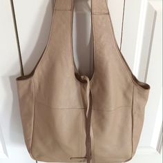 Totally On Trend, The Rhyn Hobo Bag From Lucky Brand Has Enough Room For All Your Essentials Plus You'll Look Like A Million Bucks When You Carry It! Details: Ultrasoft Leather In Light Camel Tan (Did I Mention It's Ultrasoft!?) Magnetic Snap Closure One Shoulder Strap With 13" Drop Exterior Pockets: 1 Slip Interior Pockets: 1 Zip, 1 Slip Fabric Lining Measures 13½" L X 5" W X 12" H Brand New With Tag Beige Satchel Shoulder Bag With Leather Backing, Beige Satchel Bag With Leather Backing, Beige Satchel With Leather Backing, Beige Leather-backed Satchel Shoulder Bag, Beige Textured Leather Hobo Tote Bag, Beige Textured Leather Hobo Bag For Daily Use, Beige Tote Bag With Leather Lining, Beige Leather Hobo Shoulder Bag, Beige Textured Leather Hobo Bag For Everyday Use