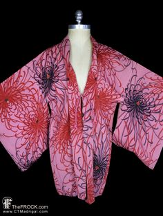 "www.TheFROCK.com www.CTMadrigal.com www.amazon.com/author/ctmadrigal Vintage, near antique, silk kimono with red chrysanthemums on a mauve (or similar) background. Lined in a fan and floral patterned silk. Haori himo ties. Condition is excellent with age-appropriate wear. Measures about 41\" around when tied, and 33\" long. Layaway is available. Age-appropriate wear on vintage and antique kimonos may include slight color variation or bleed on vintage and antique hand-dyed kimono textiles, light Red Robe With Kimono Sleeves For Spring, Spring Pink One-size Kimono, Pink Silk Long Sleeve Kimono, One Size Pink Kimono For Spring, Pink Silk Kimono For Spring, Pink Robe With Kimono Sleeves For Spring, Red One-size Kimono For Spring, Pink Floral Print Long Sleeve Kimono, Red One-size Kimono For Fall