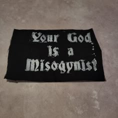 a patch that says, your god is a misgognist