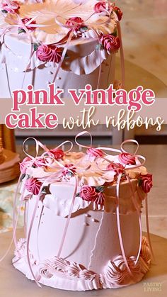 a pink vintage cake with ribbons and flowers