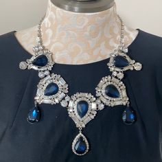 New With Tag! Simply Stunning Statement Necklace! Silver Tone With Deep Blue & Clear Rhinestone Accents. The Center Piece Including Dangle Is Approx 3.5” Long Chain Has 3” Extender To Adjust Length Of Necklace Elegant Blue Rhinestone Necklace For Wedding, Blue Crystal Necklace With Diamond Accents, Blue Crystal Necklaces With Diamond Accents, Elegant Blue Rhinestone Necklace With Sparkling Stones, Elegant Sapphire Necklace For Party, Elegant Blue Crystal Rhinestone Necklace, Elegant Blue Rhinestone Necklace For Formal Occasions, Blue Jewelry With Diamond Accents For Evening, Blue Evening Jewelry With Diamond Accents