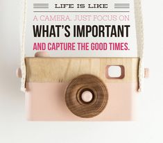 an old camera is sitting on top of a piece of paper with the words life is like a camera just focus on what's important and capture the good times