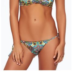 A Classic Tie Side Bikini Bottom With A Multitude Of Styling Options! You’ll Be Reaching For The Zulu Tribal Two Timer Time And Time Again! This Bottom Is A Reversible Style To A Solid Black With The Vibrant Tribal Print On The Other Side. Tie Side Bottom Vibrant Tribal Print Reverses To Solid Black 91% Nylon, 9% Spandex Bohemian Fitted Tie-side Bottoms, Fitted Bohemian Tie-side Bottoms, Bathing Suit Top, Zulu, The Other Side, Solid Black, Womens Swim, Spandex, Women Shopping