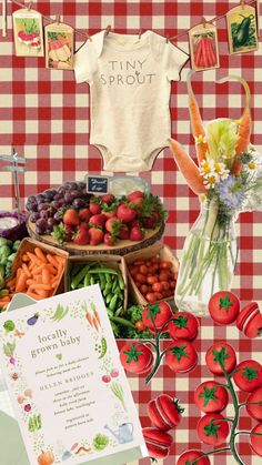 a table topped with lots of different types of fruits and vegetables next to a sign that says tiny sprout