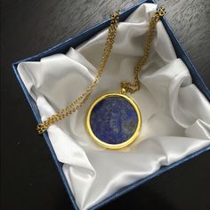 Brand New. A Gorgeous Genuine Lapis Lazuli Pendant/Necklace Set In Goldtone And Ion Plated Yellow Gold Stainless Steel. 24 Inch With A Lobster Clasp. Stricking! Pendant Decked With A 1 - 1/2 Inch Round Disc Lapis Goldflakes Stone, Giving It A Very Spectacular Look, No Matter What You Decide To Wear It With.! Being A Natural Stone, With It's Authentic Unique Coveted Shades No Two Would Ever Look The Same, Adding Special Attention To It. Durable. Non Allergenic Metal. Opera Length. Makes The Perfe Blue Jewelry With Detachable Round Pendant, Blue Jewelry With Detachable Pendant, Luxury Blue Locket Necklace, Blue Coin Pendant Jewelry For Gifts, Blue Coin Pendant Jewelry As Gift, Lapis Lazuli Round Pendant Jewelry Gift, Lapis Lazuli Round Pendant Jewelry For Gift, Blue Medallion Locket Necklace As Gift, Blue Necklace With Detachable Round Pendant