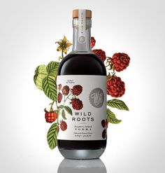 a bottle of wild roots raspberry syrup with leaves and berries on the label