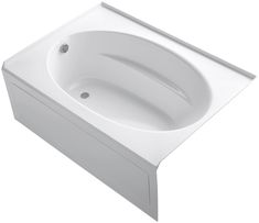 a white bath tub sitting on top of a counter