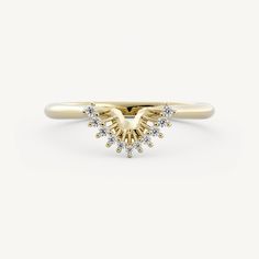 a yellow gold ring with two small white diamonds on the top and an arrow shaped band