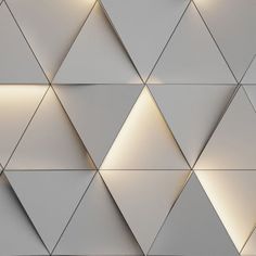 the wall is made up of white triangles