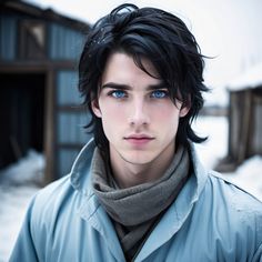 a man with black hair and blue eyes is standing in the snow