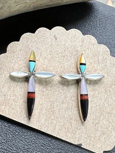 These are a beautiful handcrafted pair of Zuni earrings.  They're multi stone, set in Sterling Silver & SIGNED on the back 'LR' & Sterling.  They measure 25mm x 18mm & will be a memorable gift for someone special this Holiday Season. Please look at all the photos carefully. Welcome to NorthWestTradingCo. Stone Cross, Mount Vernon, Cross Earrings, Multi Stone, Memorable Gifts, Jewelry Earrings Studs, Nativity, Native American, Holiday Season