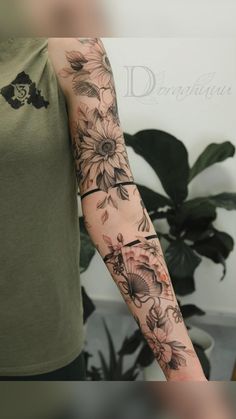 a woman's arm with flowers on it