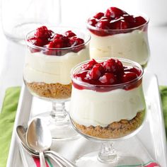 two desserts on a white plate with spoons