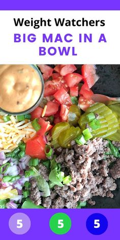 a bowl filled with meat and veggies on top of a table