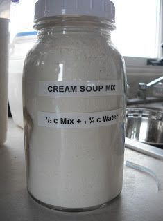 a white jar sitting on top of a counter next to a sink and faucet