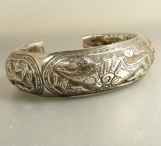 Vintage Chinese Sterling Cuff Bracelet Repousse Lotus & Bat Wings Engraved Cuff Bangle For Wedding, Wedding Engraved Cuff Bangle, Engraved Cuff Bracelet For Wedding, Traditional Cuff Bangle For Wedding, Elegant Ceremonial Cuff Bangle, Traditional Adjustable Cuff Bracelet For Formal Occasions, Traditional Engraved Cuff Bracelet For Formal Occasions, Traditional Cuff Wedding Jewelry, Unique Cuff Bangle For Wedding