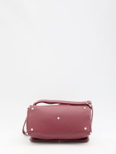 This red grained leather Postina Daily S bag boasts a fixed top handle, adjustable and detachable shoulder strap, turn-lock closure, and two main interior compartments. It also includes one interior zip pocket, one interior flat pocket, and a dust bag.    Dimensions: 12x5.9x7.4   Size nationality: UNI  Product code: 068010S0040000Z0940  Composition: 100% leather Daily Use Top Handle Box Bag With Silver-tone Hardware, Everyday Box Bag With Top Handle And Silver-tone Hardware, Top Handle Satchel With Silver-tone Hardware In Pebbled Leather, Everyday Top Handle Box Bag With Silver-tone Hardware, Burgundy Leather Shoulder Bag With Detachable Handle, Burgundy Top Handle Satchel For Business, Red Satchel Briefcase With Top Carry Handle, Red Pebbled Leather Bag For Everyday Use, Business Shoulder Bag With Detachable Strap In Burgundy