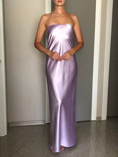 Strapless silk satin slip dress. Can be worn as a bridesmaid dress, party and date dress and for many other occasions. Made of satin silk. DESCRİPTİON:   -Strapless.  -Elastic band on the bust part.  -Adjustable bust.  -Designed for a slim but relaxed fit.  -Unlined.  -Bias cut. İt is a custom made dress, tailored according to your preferences, you can choose the length of the dress and order it with cut on the right side. While ordering write your bust, waist and hips measure, so the dress will be made to your size. Please enquire if you're interested in different color. SIZING INFO: XS/34/US4: bust: 82-86cm (32-33 inch) waist 64-66 cm (24-25 inch)  S/36/ US6: bust: 86-88cm (33-34 inch) waist: 66-68 cm (25-26 inch) M/38/ US8: bust: 88-92 cm (34-36 inch) waist: 68-72 cm (26-28 inch) L/40/ Light Purple Bridesmaid Dress, Purple Silk Satin Evening Dress, Strapless Purple Satin Dress, Purple Satin Slip Dress For Spring, Spring Purple Satin Slip Dress, Elegant Purple Satin Slip Dress, Purple Satin Maxi Dress For Evening, Purple Silk Slip Dress For Evening, Purple Silk Evening Slip Dress